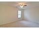 Bright bedroom features ceiling fan and large window at 732 Jacoby Dr, Loganville, GA 30052