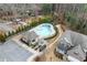 Aerial view of community pool, clubhouse, fire pit, and lush landscaping offering resort-style living at , Duluth, GA 30096