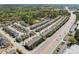 Aerial view of a neighborhood showcasing multiple townhomes near a major road at , Duluth, GA 30096