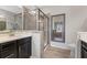 Bathroom featuring a glass-enclosed shower, vanity, and modern tile flooring at , Duluth, GA 30096
