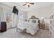 Serene main bedroom with tray ceilings, soft carpet, and bright windows for natural light at , Duluth, GA 30096