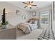 Cozy bedroom featuring neutral tones, a ceiling fan and stylish decor, creating a relaxing atmosphere at , Duluth, GA 30096
