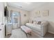 Stylish bedroom featuring a comfy daybed, complemented by elegant decor and soft, inviting textures at , Duluth, GA 30096