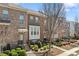 Lovely townhome exterior with brick facade, bay window, and landscaped front yard at , Duluth, GA 30096