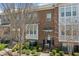 Attractive townhome exterior showcasing brick facade, entry stairs, and well-maintained landscaping at , Duluth, GA 30096