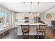 Well-lit kitchen boasts a large island, breakfast bar, and a cozy window bench at , Duluth, GA 30096