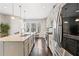 Bright kitchen features stainless steel appliances, quartz countertops, and stylish pendant lighting at , Duluth, GA 30096