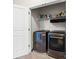 Convenient laundry area with modern front-load machines and ample storage for an efficient cleaning experience at , Duluth, GA 30096