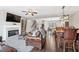 Cozy living room featuring fireplace, stylish furniture, dining area, and open floor plan at , Duluth, GA 30096