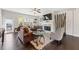 Comfortable living room with fireplace, hardwood floors, large windows, and stylish furniture at , Duluth, GA 30096