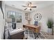 Functional office space with a rustic desk, comfortable seating, and ample natural light, perfect for productivity at , Duluth, GA 30096