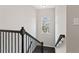 Nicely trimmed stairwell with a dark wood railing and hardwood floors at , Duluth, GA 30096