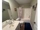 A full bathroom featuring a shower-tub combo and a white sink with a large mirror at 3426 Olivia Grace Way, Dacula, GA 30019