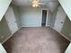 A bedroom featuring neutral colored carpet, ceiling fan, and white trim at 3426 Olivia Grace Way, Dacula, GA 30019