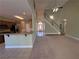 Open living area with hardwood and carpeted floors, and staircase at 3426 Olivia Grace Way, Dacula, GA 30019