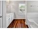 This bathroom offers double sinks and a separate tub, combining style and function at 4970 Wewatta Sw St, Atlanta, GA 30331
