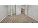 Bedroom featuring a closet and neutral carpeting at 4970 Wewatta Sw St, Atlanta, GA 30331
