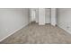 Neutral bedroom featuring carpeting, neutral walls, and open closet at 4970 Wewatta Sw St, Atlanta, GA 30331