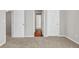 Neutral carpeted bedroom featuring two open doors at 4970 Wewatta Sw St, Atlanta, GA 30331