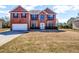 Traditional two-story brick home with an attached garage and large front lawn at 4970 Wewatta Sw St, Atlanta, GA 30331