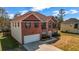 An exterior view of a brick home featuring an attached garage and side-yard access at 4970 Wewatta Sw St, Atlanta, GA 30331
