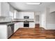 Bright kitchen with white cabinets, stainless steel appliances, and modern countertops at 4970 Wewatta Sw St, Atlanta, GA 30331