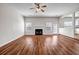 Bright and airy living room featuring a fireplace, hardwood floors, and plenty of natural light at 4970 Wewatta Sw St, Atlanta, GA 30331