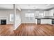 Open concept living space with laminate flooring, fireplace and kitchen at 4970 Wewatta Sw St, Atlanta, GA 30331