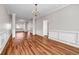 Open concept living space with laminate flooring and stylish trim throughout at 4970 Wewatta Sw St, Atlanta, GA 30331