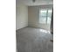 Carpeted bedroom featuring a window that allows plenty of natural light at 7925 Timberline Overlook, Cumming, GA 30041