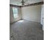 Bedroom featuring neutral walls and soft carpeting, complemented by a window at 7925 Timberline Overlook, Cumming, GA 30041
