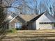 Charming single-Gathering home featuring stone accents and a two-car garage at 7925 Timberline Overlook, Cumming, GA 30041