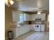 Traditional kitchen with white cabinets, modern appliances, and a tiled floor at 7925 Timberline Overlook, Cumming, GA 30041