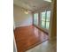 Bright room with hardwood floors, ceiling fan, and big windows allowing great sunlight at 7925 Timberline Overlook, Cumming, GA 30041