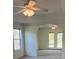 Bright living room featuring archway, a ceiling fan, and windows with natural light at 7925 Timberline Overlook, Cumming, GA 30041