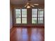 Cozy room featuring hardwood floors and large windows offering great sunlight at 7925 Timberline Overlook, Cumming, GA 30041