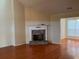 Cozy living room with stone fireplace and hardwood flooring at 7925 Timberline Overlook, Cumming, GA 30041