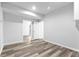Spacious basement area with laminate flooring and access to other rooms at 1484 Highland Bluff Ct, Suwanee, GA 30024