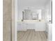 Bathroom with double sinks, shower and a tub in the background at 1484 Highland Bluff Ct, Suwanee, GA 30024