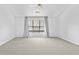 Spacious bedroom features neutral carpet and modern ceiling fan at 1484 Highland Bluff Ct, Suwanee, GA 30024