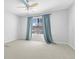 Bedroom featuring a window, ceiling fan, and neutral carpet at 1484 Highland Bluff Ct, Suwanee, GA 30024
