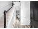 Bright foyer with hardwood floors, staircase, and neutral paint palette at 1484 Highland Bluff Ct, Suwanee, GA 30024