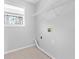 Laundry room with a window and storage at 1484 Highland Bluff Ct, Suwanee, GA 30024