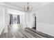 Living room with an open floor plan with stylish wood flooring and natural light at 1484 Highland Bluff Ct, Suwanee, GA 30024