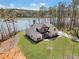 Aerial view of beautiful brick home with large yard, long driveway, and lake view at 180 Allie Dr, Mcdonough, GA 30252