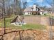 Backyard featuring a fire pit area with steps leading to the main property at 180 Allie Dr, Mcdonough, GA 30252