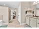 Open bathroom with standing shower, granite countertops, and warm neutral tones at 180 Allie Dr, Mcdonough, GA 30252