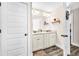 Bathroom featuring granite countertops, hardwood floors, and stylish decor at 180 Allie Dr, Mcdonough, GA 30252