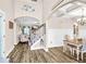 Dining room featuring elegant decor and an open floor plan to the living room and staircase at 180 Allie Dr, Mcdonough, GA 30252