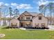 Charming two-story brick home with manicured lawn and inviting front porch at 180 Allie Dr, Mcdonough, GA 30252